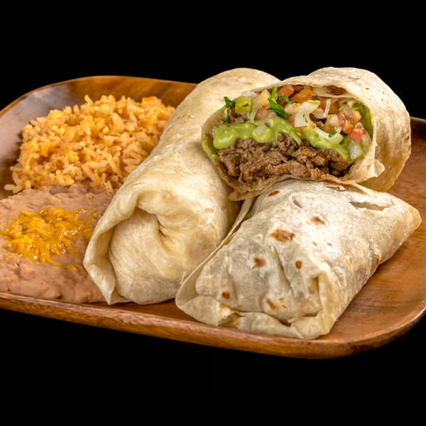 Three burritos, one cut open to show meat, guacamole, and pico de gallo, with rice and beans.